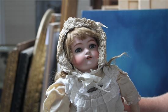 A Simon & Halbig Kammer & Reinhardt doll, original clothes, body in good condition, pale oily bisque, pierced ears, 20in.